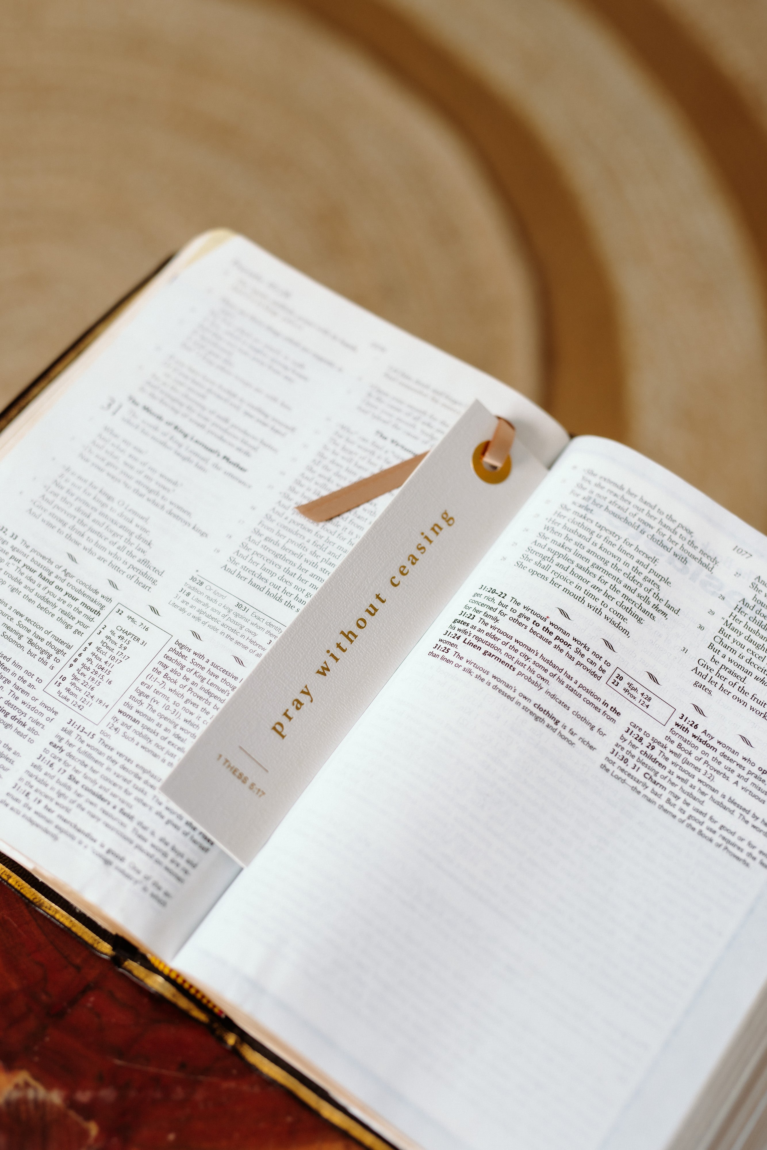 Pray without ceasing bookmark onto of an open bible.