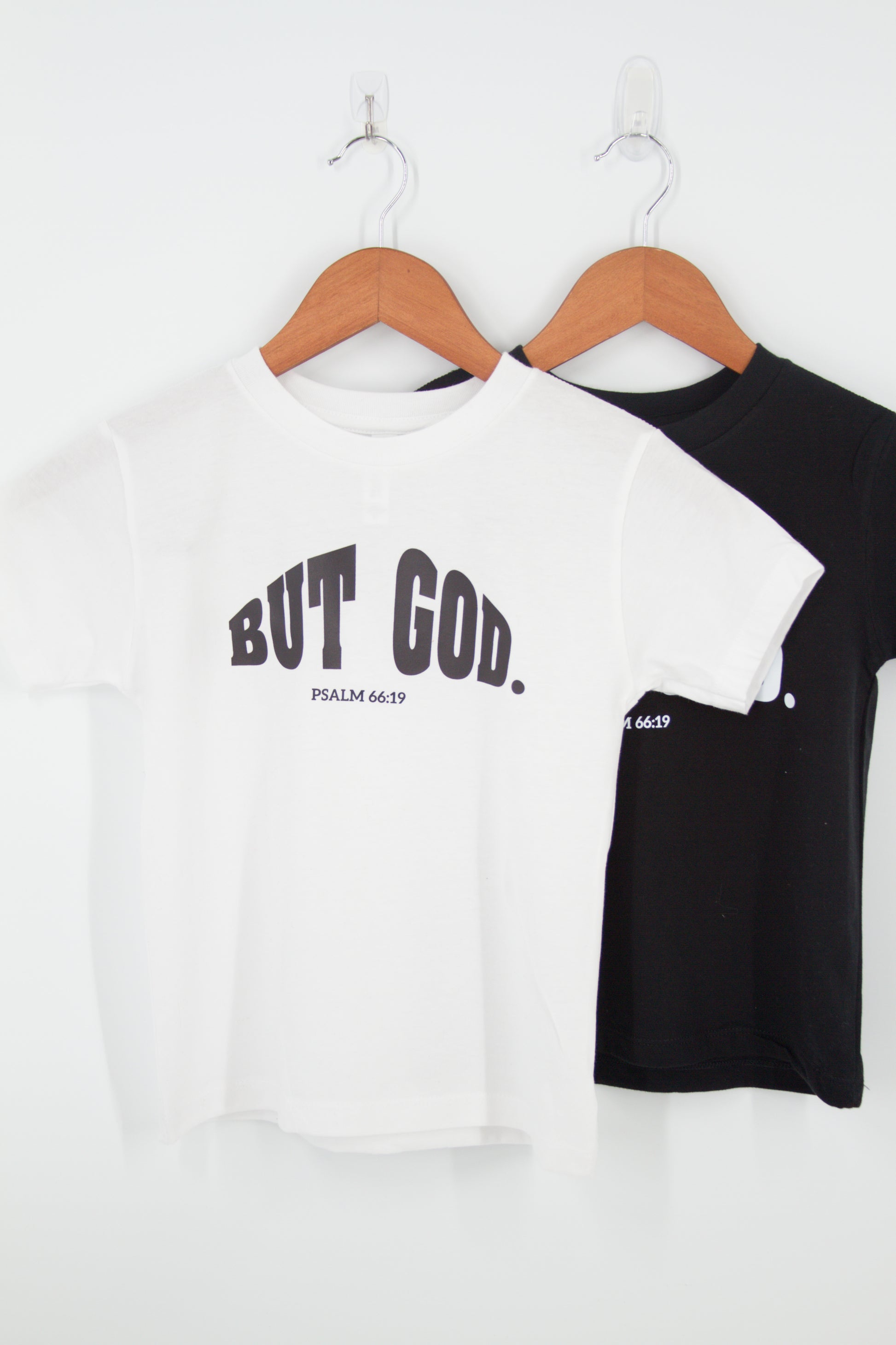 "But God. Psalm 66:19 " written over chest t-shirt in white