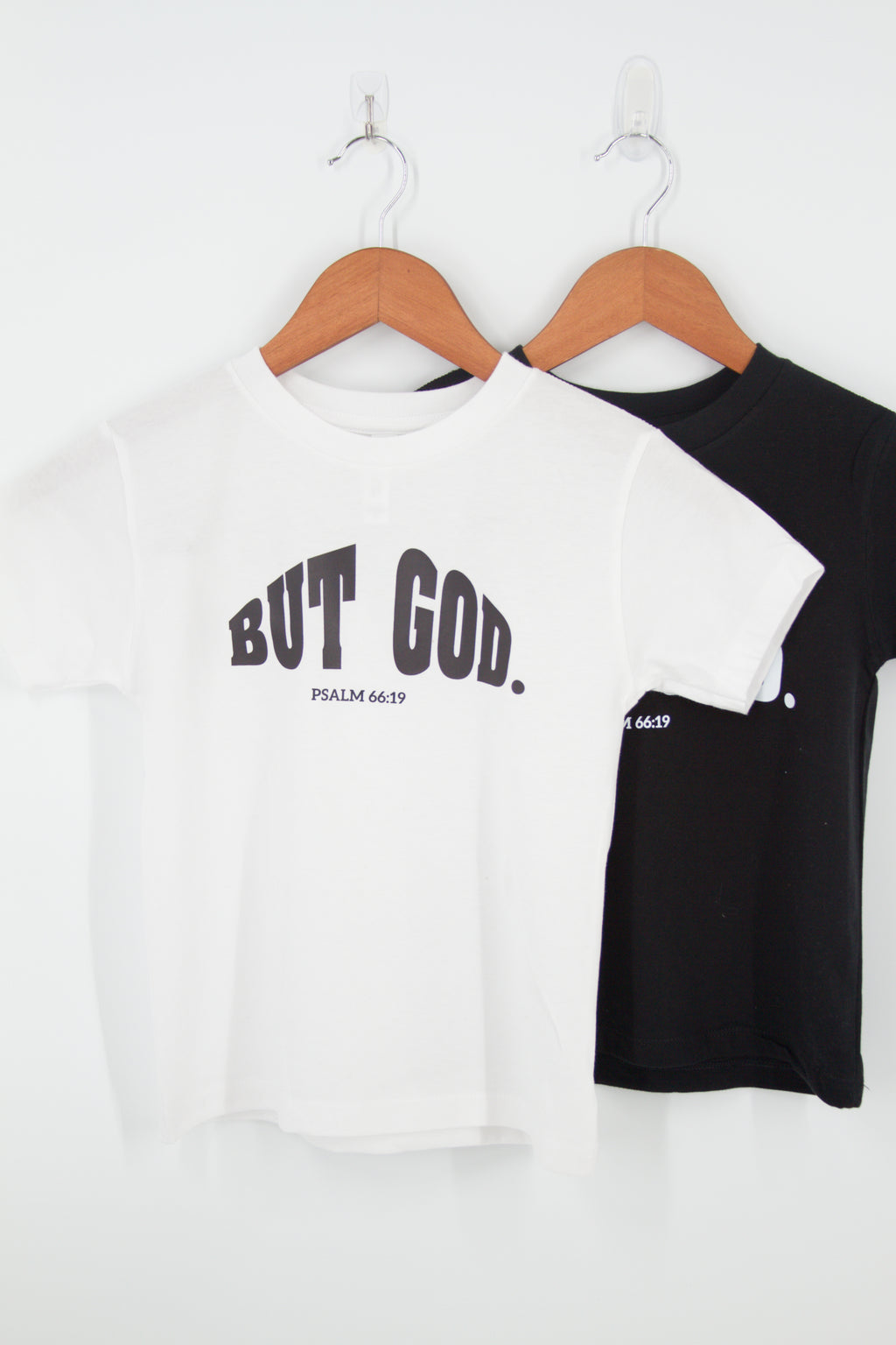 "But God. Psalm 66:19 " written over chest t-shirt in white 